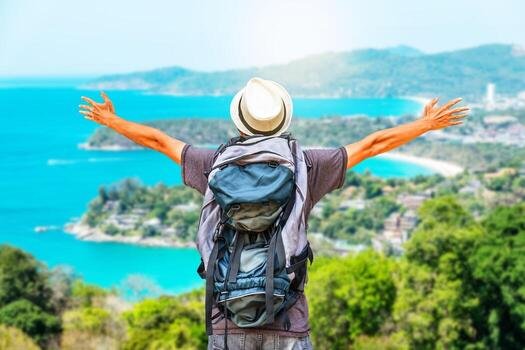 rear-view-portrait-of-young-man-traveler-with-backpack-standing-on-a-mountain-with-arms-spread-open-travel-life-style-and-adventure-concept-free-photo.jpg